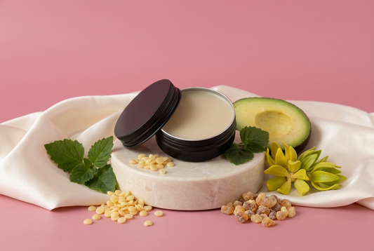 Natural Heal Salve with ingredients and rose-pink background